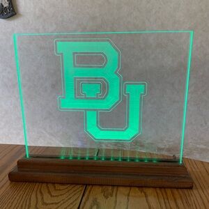 Baylor University’s green light up sign with metal hanging sign still in plastic